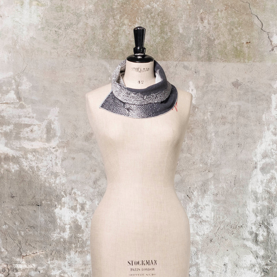 Knitted Byre cowl. Abstract, graphic design in an asymmetric shape. Shown in Charcoal and stone white