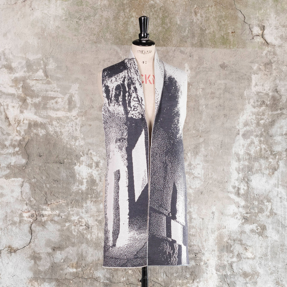Knitted Byre scarf. Abstract, graphic design in an asymmetric shape. Shown in Charcoal and stone white