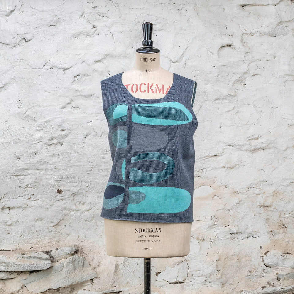 Knitted sleevless tanque in blues with accents in aqua. The pattern is abstract