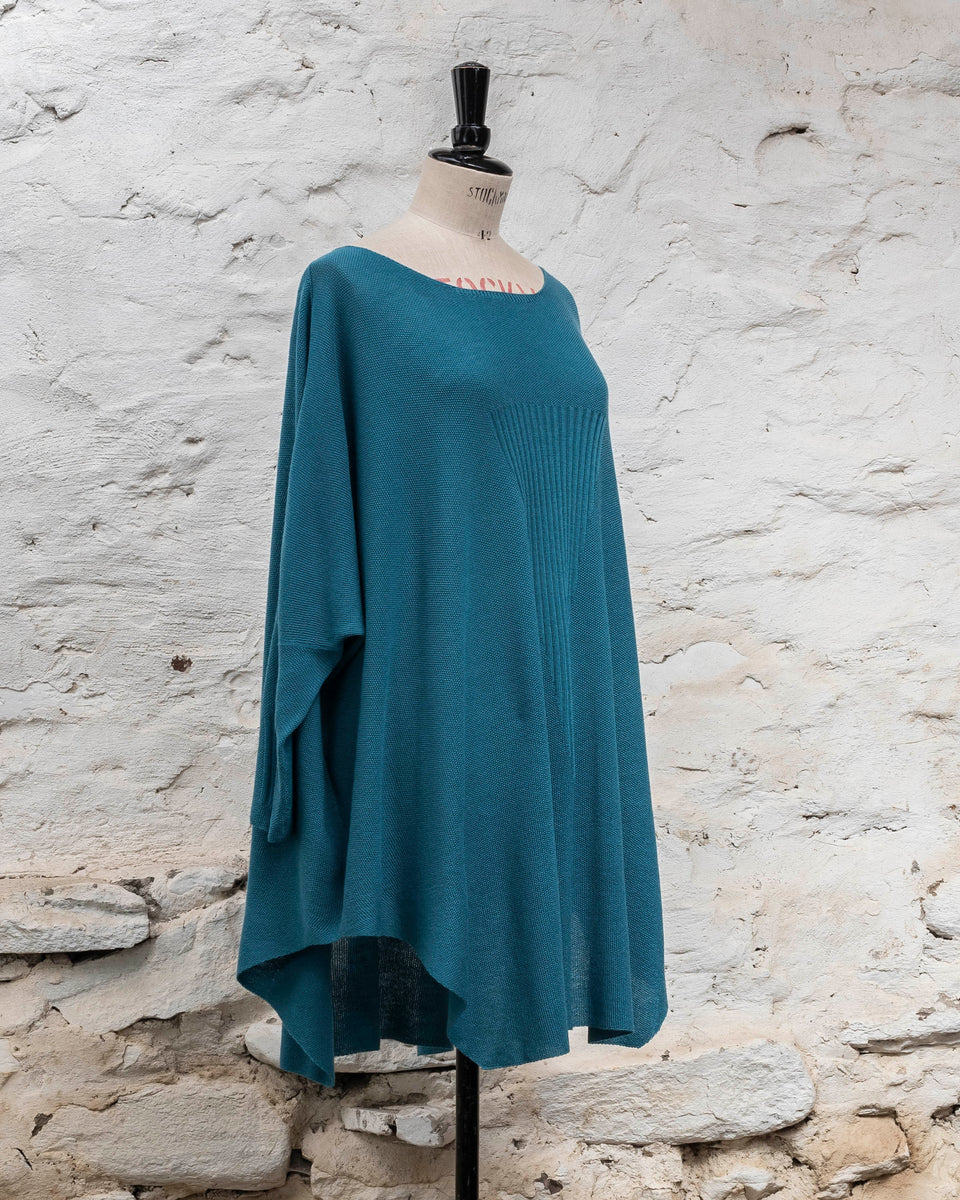 Knitted Saand jumper. contemporary sweater design in a boxy but flowing shape. Flat colour in a textured stitch. Shown in aqua