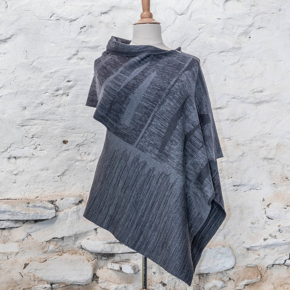 knitted inklines long squint cape. abstract, linear pattern. Shown in midnight greys