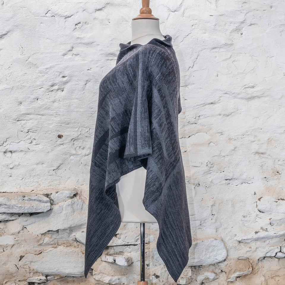 knitted inklines long squint cape. abstract, linear pattern. Shown in midnight greys