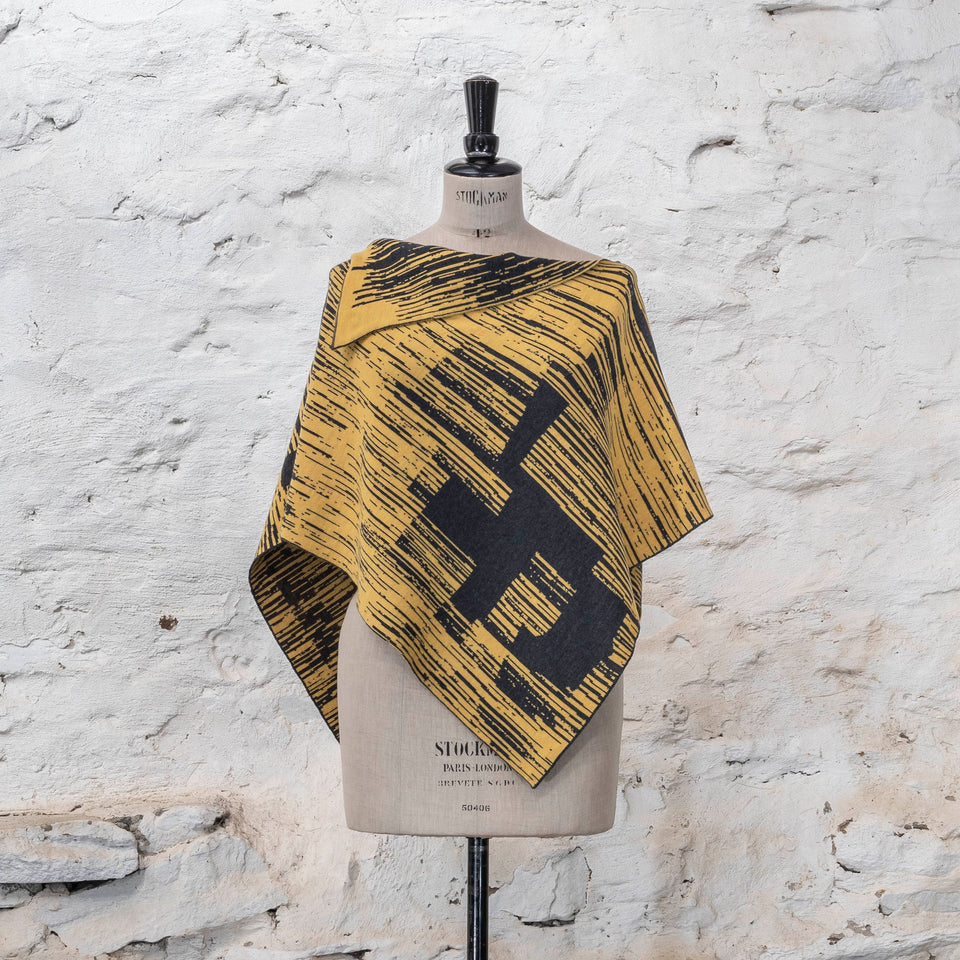 knitted inklines cape. graphic, linear, abstract pattern. Show in yellow with dark grey colourway