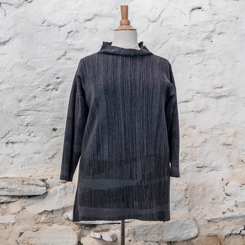knitted inklines tunic, a straight cut longline jumper with stand-up neck. Linear, abstract design. Here shown in colourway midnight greys