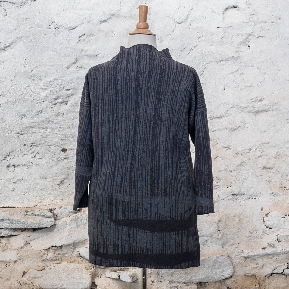knitted inklines tunic, a straight cut longline jumper with stand-up neck. Linear, abstract design. Here shown in colourway midnight greys