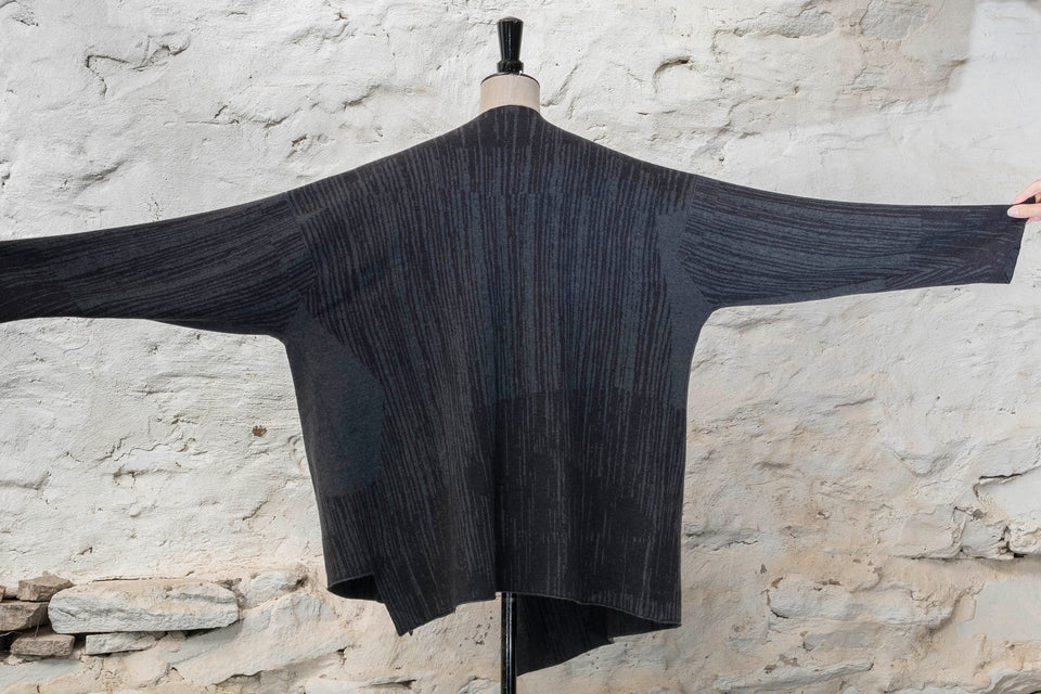 Knitted inklines jacket coatigan abstract, linear pattern. Shown in midnight greys