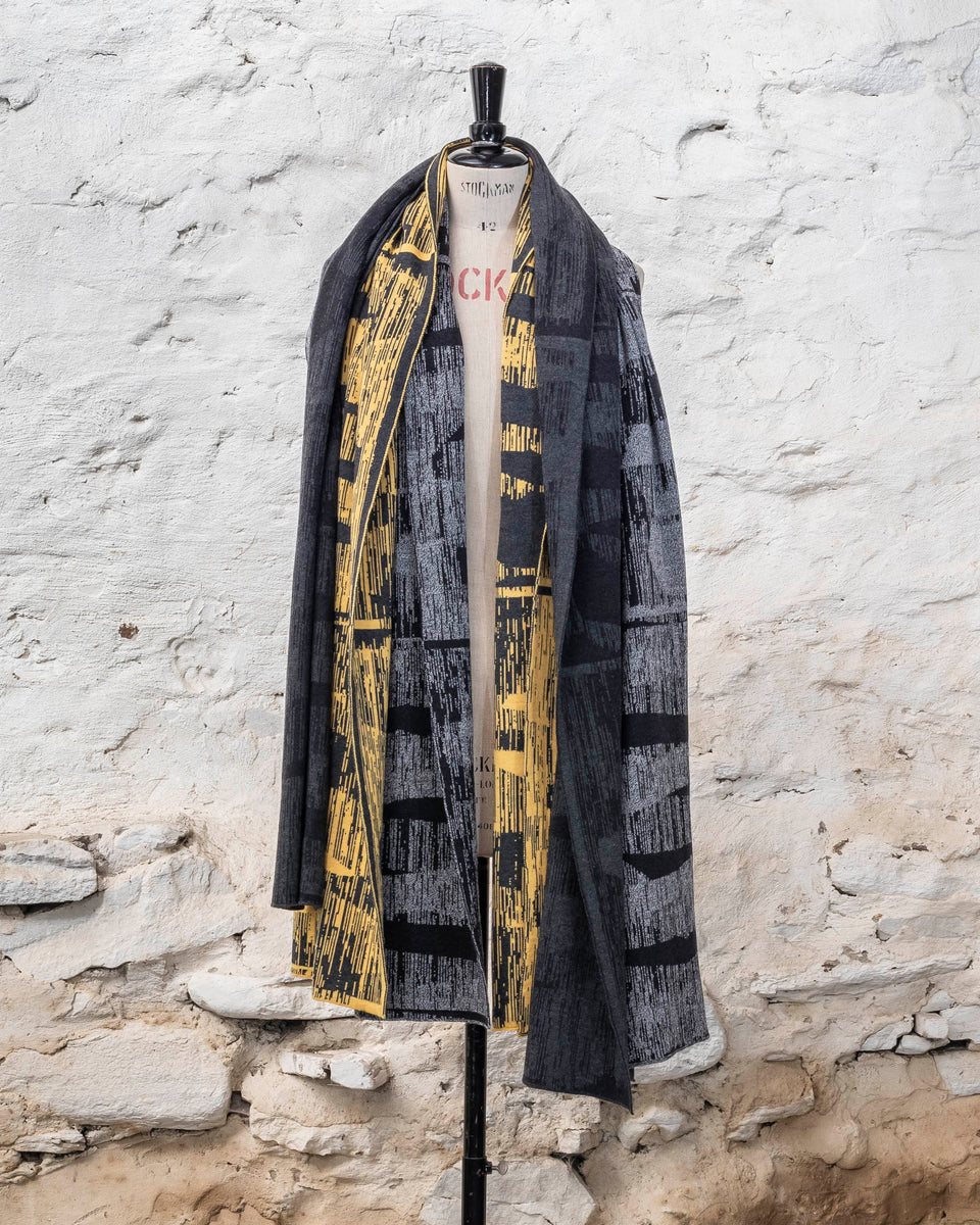 knitted inklines scarf. abstract, linear pattern shown in two greys and yellow and grey