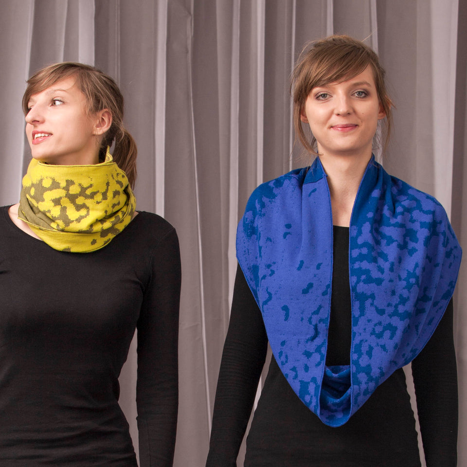 marlet twist scarf. mottled abstract animal print pattern, two shown in yellows and blues