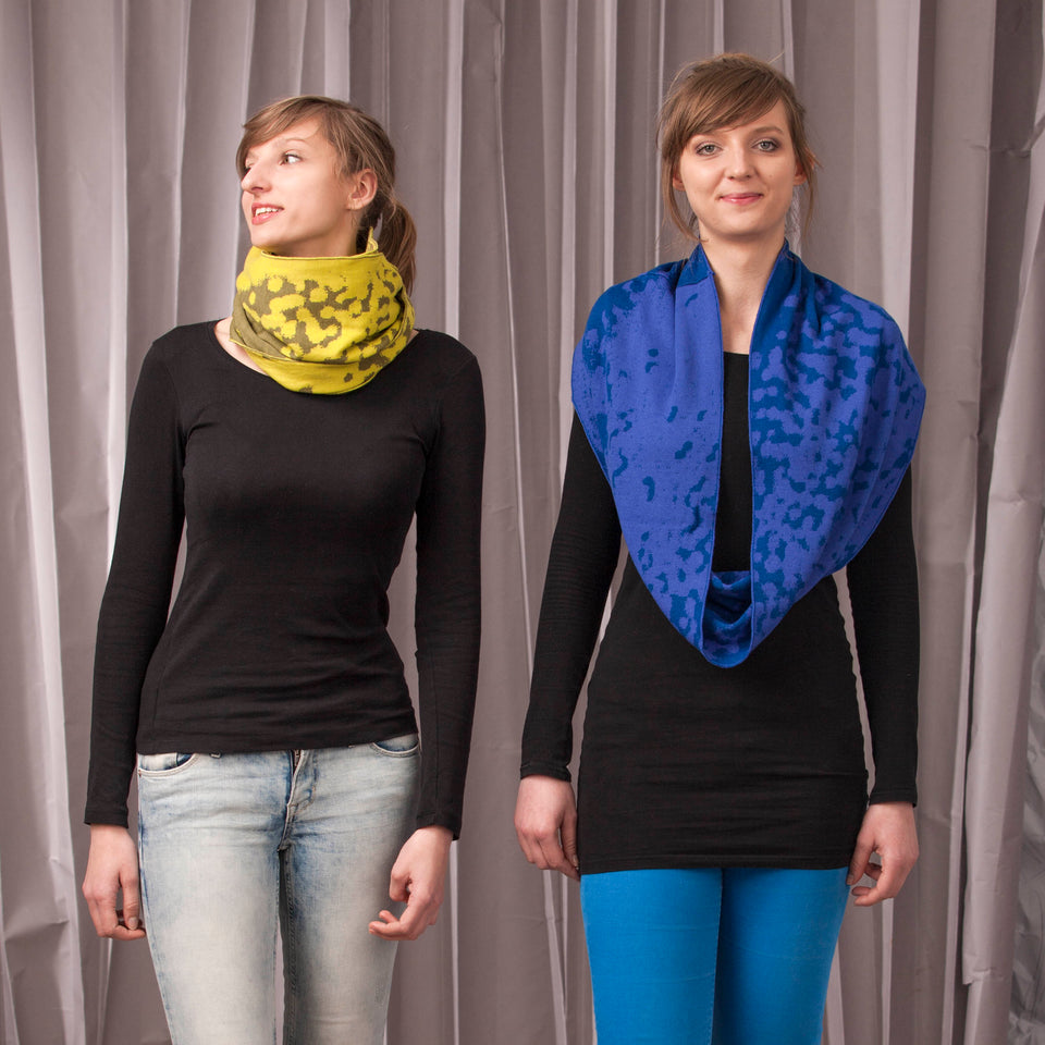 marlet twist scarf. mottled abstract animal print pattern, two shown in yellows and blues