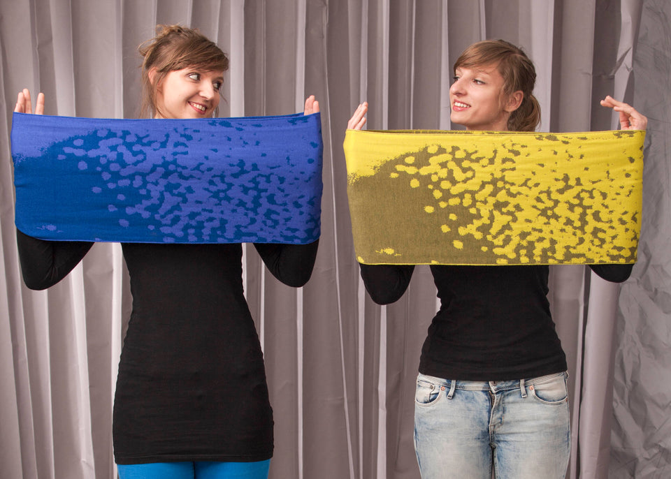 marlet twist scarf. mottled abstract animal print pattern, two shown in yellows and blues