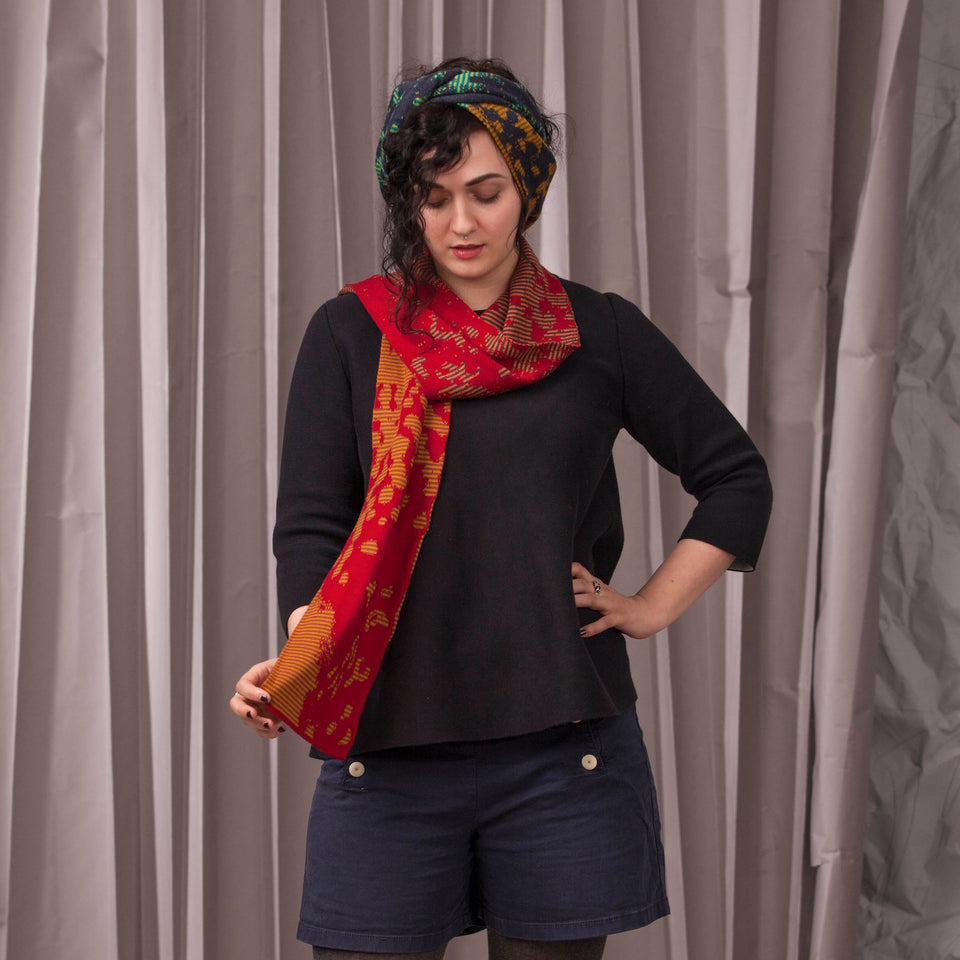 marlet scarves. mottled abstract pattern broken up by thin stripes. shown in two colourways