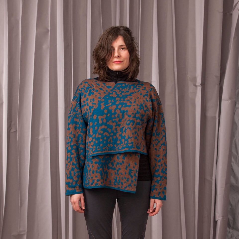 Marlet asymmetric knitted jacket. Mottled animal print, shown in dark teal and chestnut