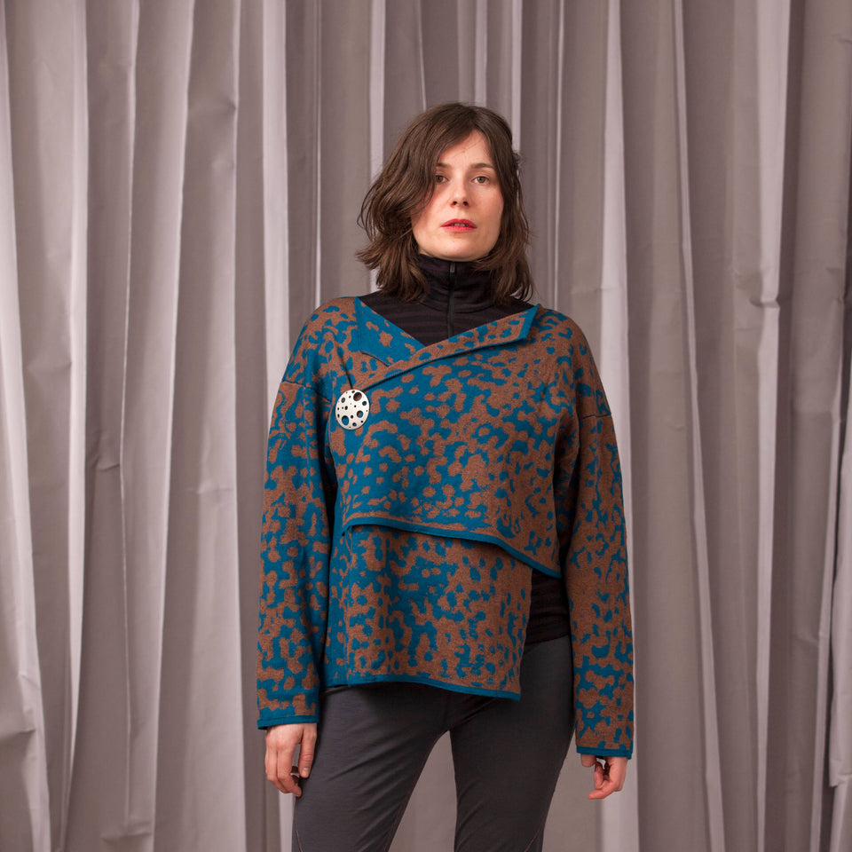 Marlet asymmetric knitted jacket. Mottled animal print, shown in dark teal and chestnut
