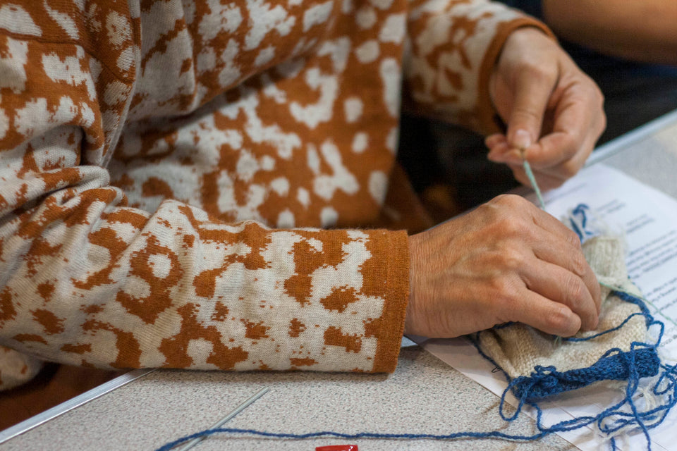 Knitted marlet jumper. Mottled animal print abstract pattern shown in light rusty brown and natural