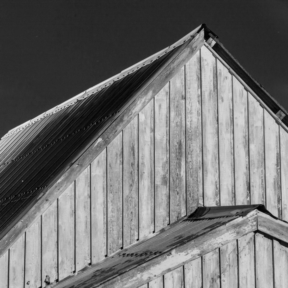 Black and white image of the gable end of the Gospel Hall, Hoswick, Shetland - a wooden chapel built in the early 1900s