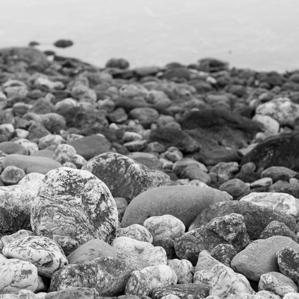 Stones revealed on the shore at low tide