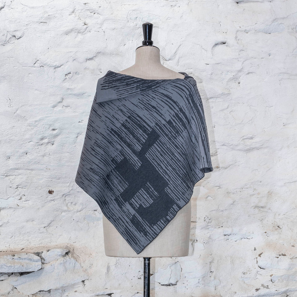 knitted inklines cape. graphic, linear, abstract pattern. Show in dusk greys colourway