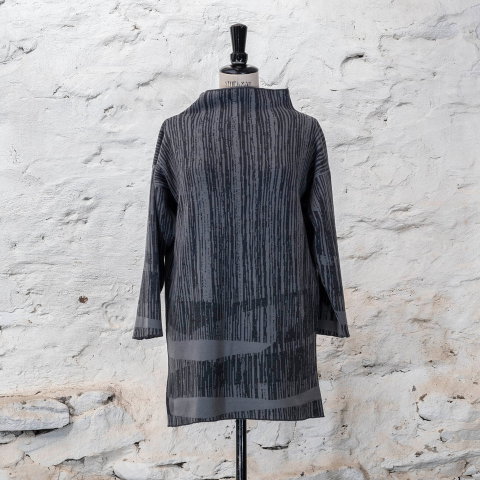 knitted inklines tunic, a straight cut longline jumper with stand-up neck. Linear, abstract design. Here shown in colourway dusk greys