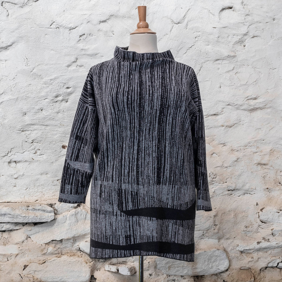 knitted inklines tunic, a straight cut longline jumper with stand-up neck. Linear, abstract design. Here shown in moonlight greys