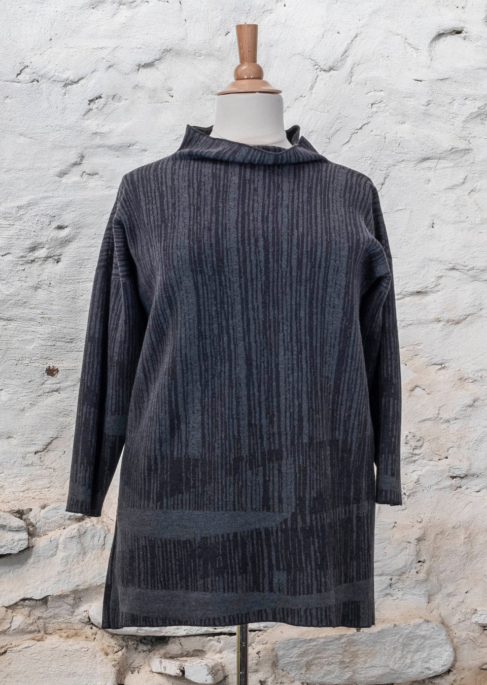 knitted inklines tunic, a straight cut longline jumper with stand-up neck. Linear, abstract design. Here shown in colourway midnight greys