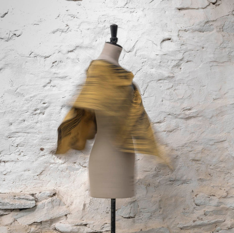 knitted inklines cape. graphic, linear, abstract pattern. Show in yellow and grey colourway