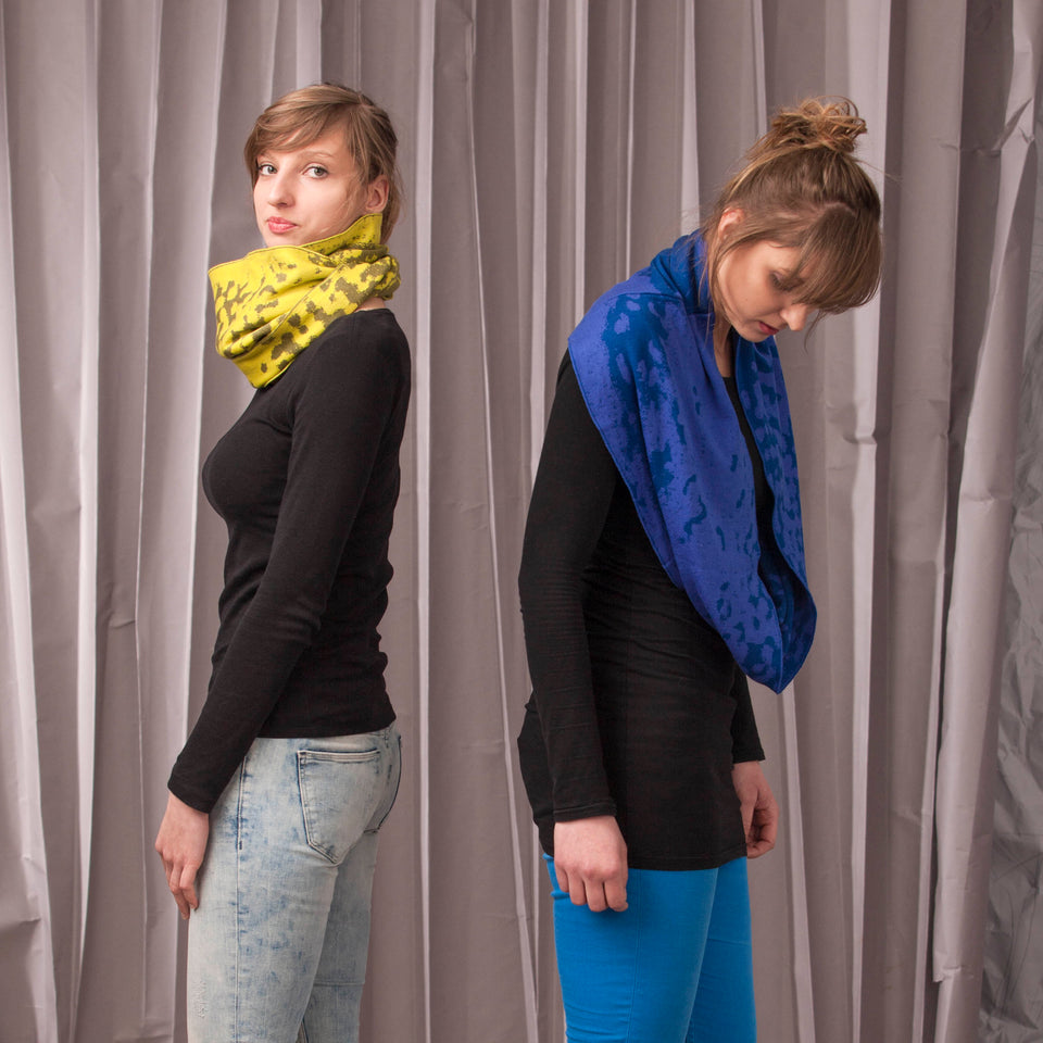 marlet twist scarf. mottled abstract animal print pattern, two shown in yellows and blues