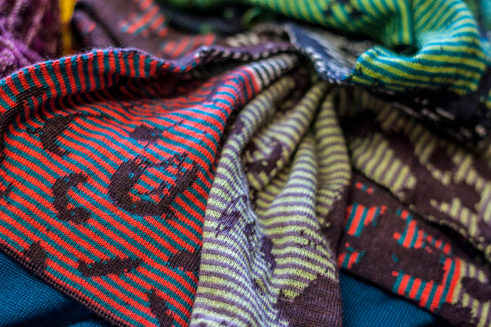 marlet scarves. mottled abstract pattern broken up by thin stripes. shown in several colours - detail