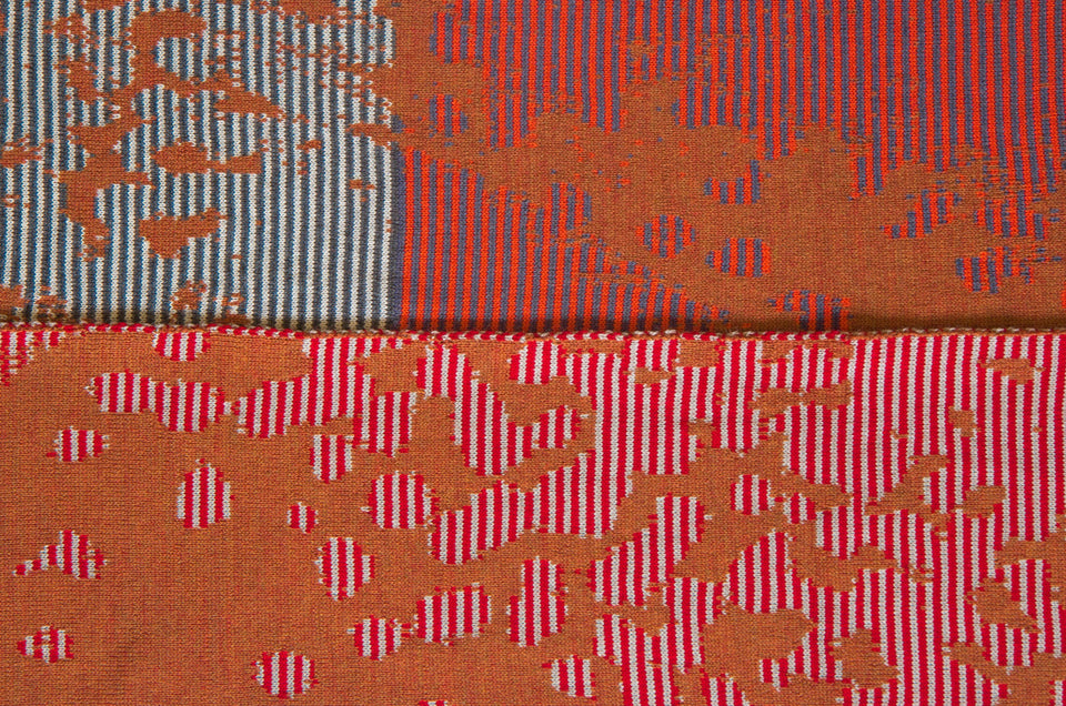 Marlet scarf swatch. Stripes break up the mottled animal print fabric. Shown in burnt orange mix