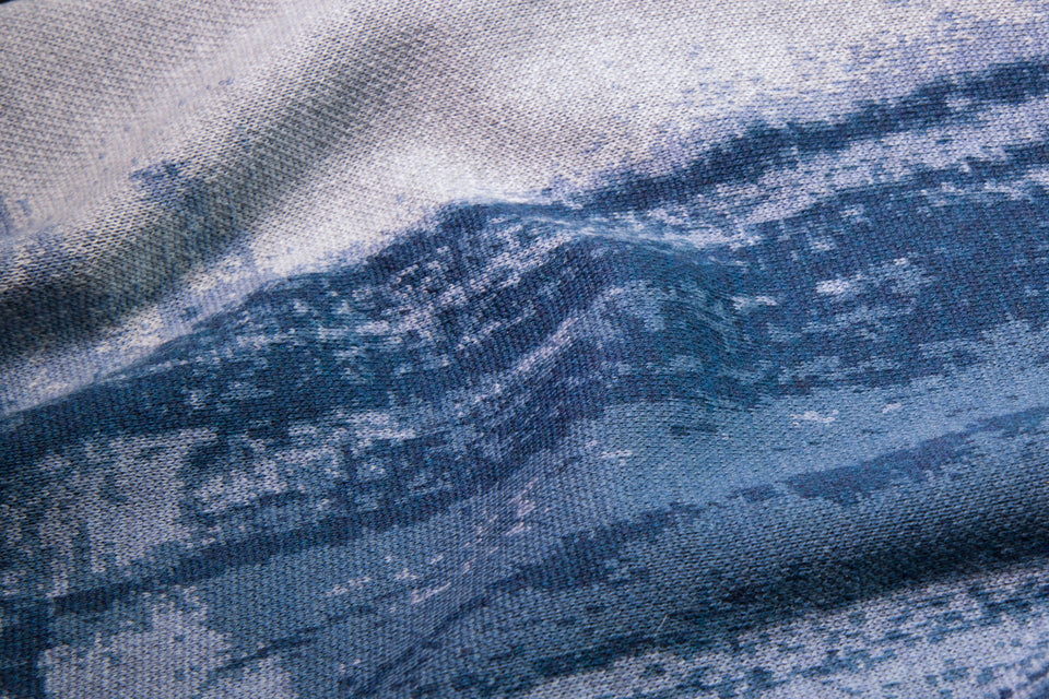 Closeup of finely knitted merino shawl in sea blues