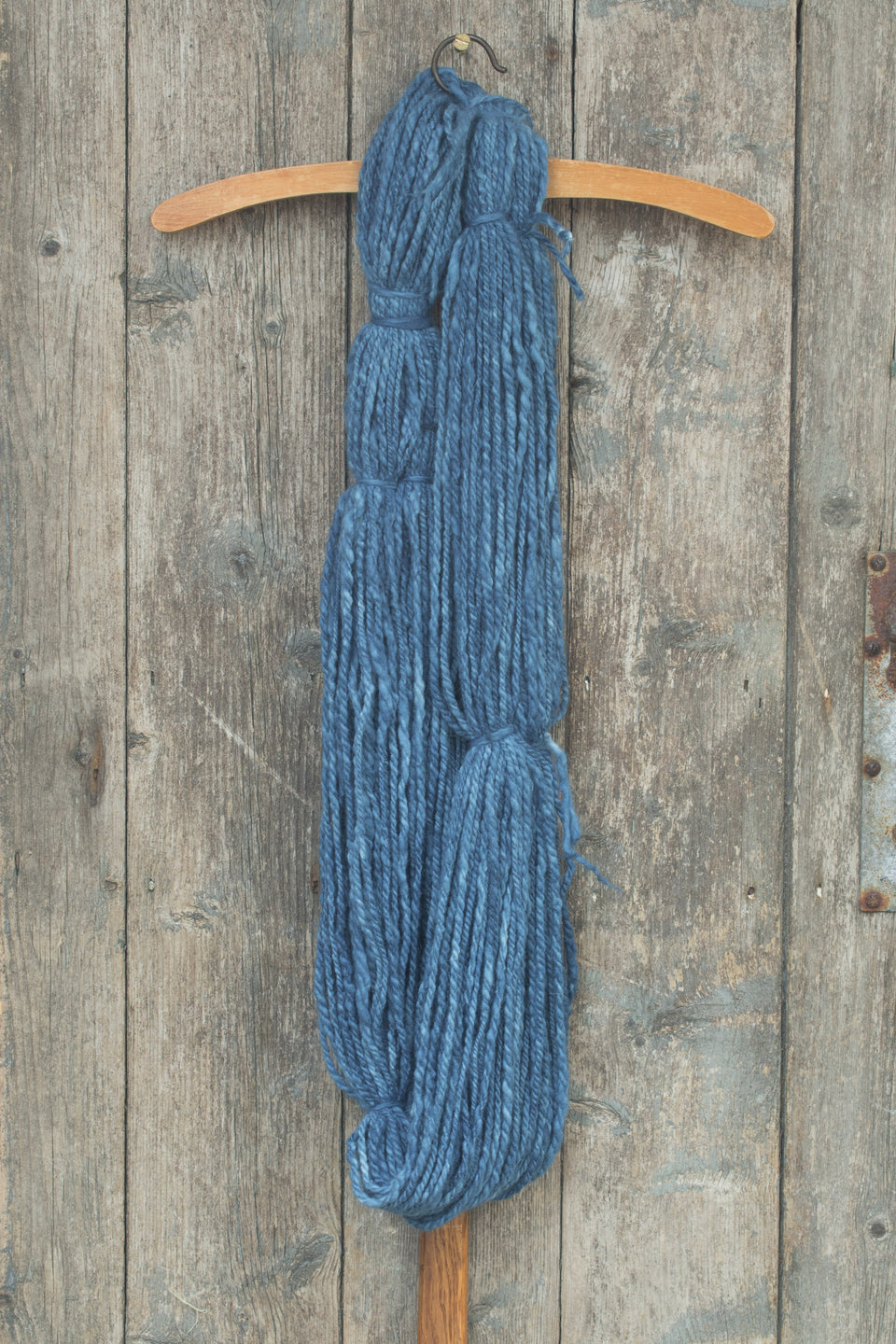 handspun yarn, hand-dyed in natural indigo. merino and cashmere. shown wound in a hank